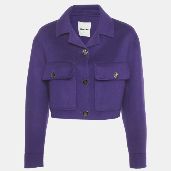 Sandro’s cropped jacket is tailored from purple wool with clean seams and discreet pockets. The vivid tone updates a timeless cut. It’s a compact piece that stands out without fuss.