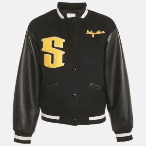Sandro’s varsity jacket combines black wool with leather panels and intricate embroidery. Its structured design adds a modern twist to classic outerwear. Ideal for elevating casual ensembles with Parisian flair.