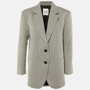 Sandro reinvents a classic pattern with this oversized blazer in black and white houndstooth. Embellished detailing lends a contemporary edge