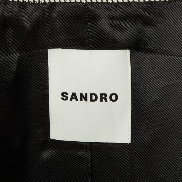 showcasing Sandro’s flair for modern urban tailoring.