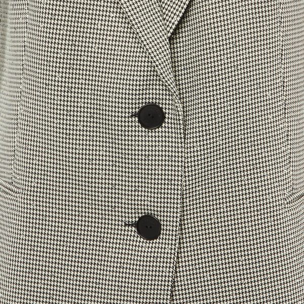 this piece bridges masculine structure with feminine styling