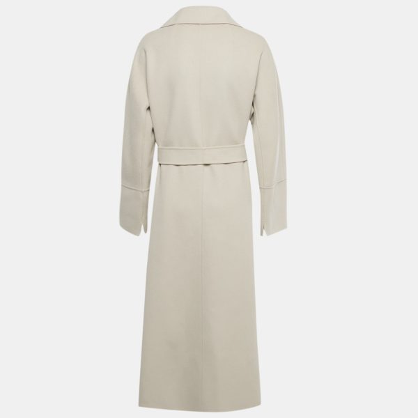 it features a wrap silhouette and self tie belt that accentuates the waist. A timeless investment in quiet elegance