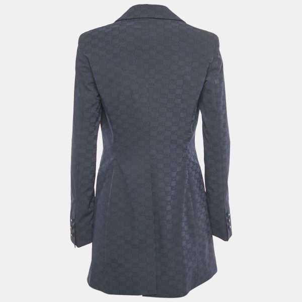 with a subtle geometric sheen. Round buttons fasten the front