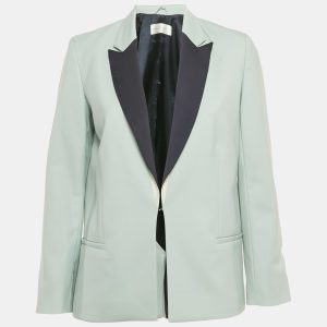 Victoria Victoria Beckham crafts a pastel blue blazer from wool crepe for a modern spin on polished suiting. The clean cut and soft colour combine to create an approachable yet elevated piece. It pairs effortlessly with matching trousers or contrasts beautifully with dark denim.