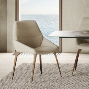 The Rutgers Dining Chair is the perfect seat for design connoisseurs. Line-tufted bucket seats imbue both elegance and comfort